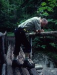 Dad resting on a bridge near Avalanche Lean-to