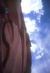 Looking up from the second belay, Casey climbs the first off-width section on the third pitch