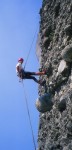 Manos rappelling amidst a sea of pebbles