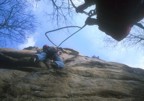 Chris climbs the initial scary section, belayed by Bones