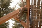 Calvin drills a hole for a dowel